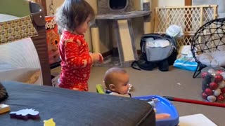 Big Sister Brushes Baby Brothers Hair