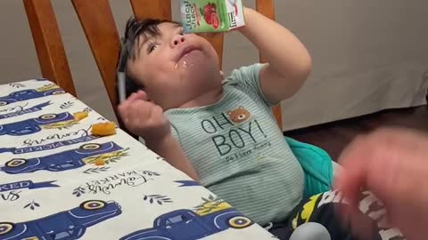 Funny baby chugging his juice