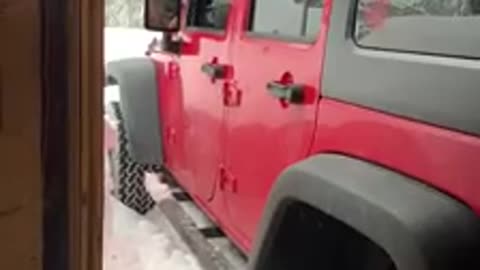 Jeep drives through giant snow