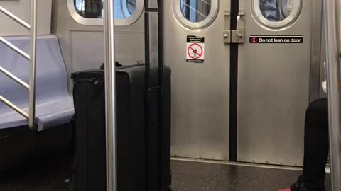 Man does tai chi in between subway cars