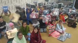 Pakistani orphans thankful to Uncle Ray for winter coats and clothes.