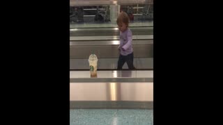 Toddler Walks Wrong Way On Moving Sidewalk