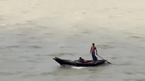 Fathers and his son in the middle of the river