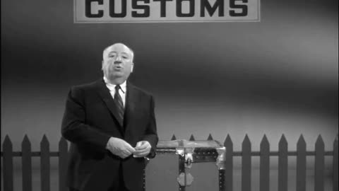 Alfred Hitchcock with a trunk from the Winnie Ruth Judd collection