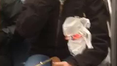 Woman puts whole fist in mouth crowded subway