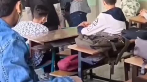 Teacher gets attacked by student in Iraq and reacts appropriately.