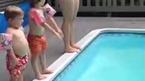 Child Performs Spectacular Belly Flop Into Pool