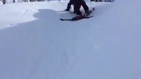 Cute kid snowboarding