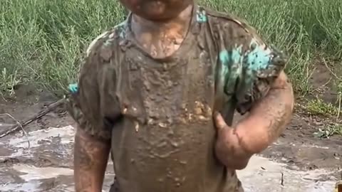 The cute muddy kid