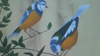 2 beautiful birds, drawn on a tree branch on the wall [Nature & Animals]
