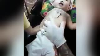 Baby gets ink tattoo from parents