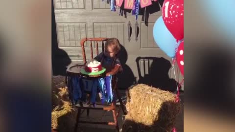 1 Year Old Boy Plays Flip Cup With Birthday Cake