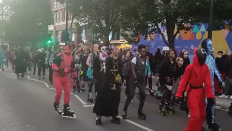 Hundreds of Halloween revellers rollerblade through streets of London