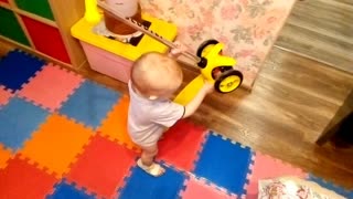 Funny baby and scooter