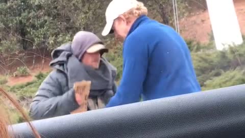 Man Gives Coat Off His Back To Homeless Man