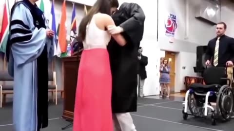 She helped her paralyzed boyfriend stand up to get his degree