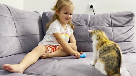 Adorable_Baby_Girl_Trying_to_Cheer_Cute_Cats