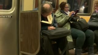 Old man asleep inside open book