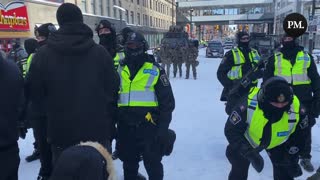 There are several heavily armed police officers on hand as they advance on the freedom protestors in Ottawa