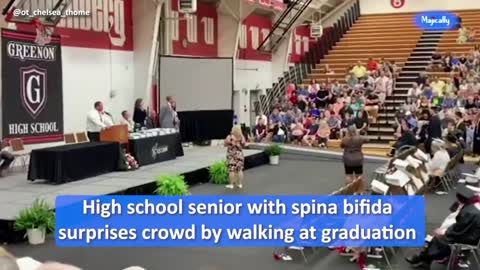 High school senior with spina bifida surprises crowd by walking at graduation