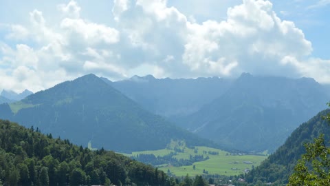 Landscape of mountains and white clouds