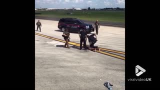 Guy clowns around on airport runway