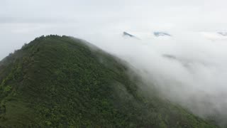 Mountain Top and Beautiful Clouds Scene