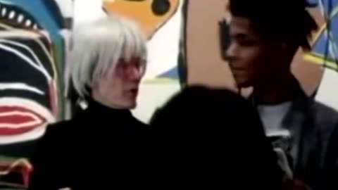 Andy Warhol and Jean Michel Basquiat in the studio together making art, 1986