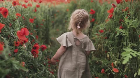 Girl Walking between Flowers