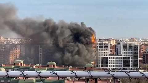 A huge fire is burning in a 14-story building in Valencia