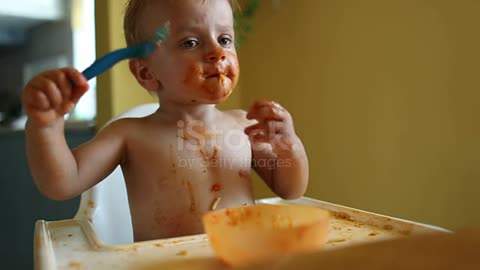 Funny video of cute baby boy eating pasta for lunch.