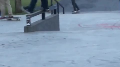 Blue hoodie skater grinds rail falls on butt
