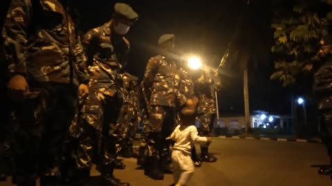 A funny baby join the army parade