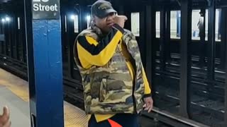 Man camouflage yellow shirt yelling station