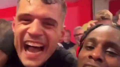 Granit Xhaka and Jeremie Frimpong celebrating Bundesliga title