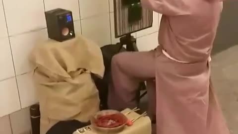 Guy in pink robe playing music