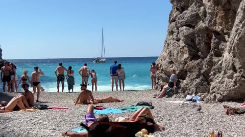 Goat Surprises Tourists on Beach