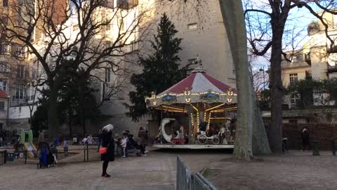 After school, busy merry-go-round in Paris