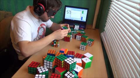 Solving 50 Rubik's Cubes blindfolded