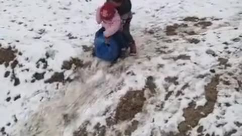 Cute children playing in snow land pakistan beauty