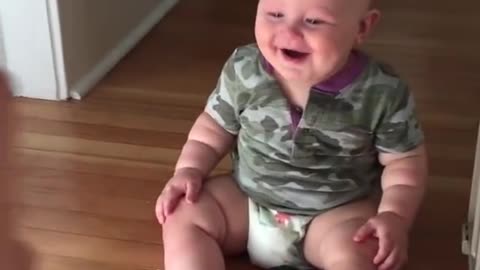 Baby laughing hysterically