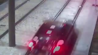 A car has been filmed being driven along train tracks in Malaga by a drunk driver