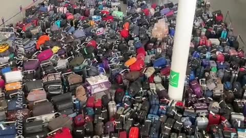 A sea of luggage piled up at Heathrow Airport due to a tech malfunction
