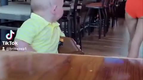 baby wants some milk from hooters waitress.