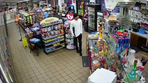 Would-Be Armed Robber Backs Away When Facing Convenience Store Clerk's Gun