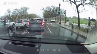 Man Jumps Out of His Car to Give a Stranger His Umbrella