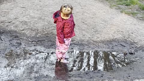Girl Finds Joy in a Mud Puddle