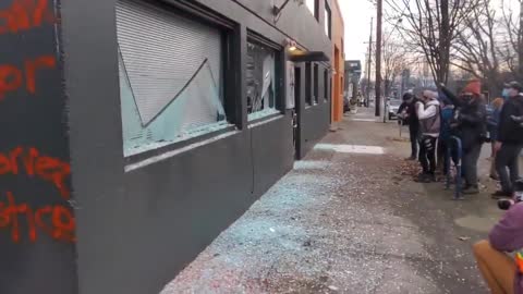 Antifa in Portland smashing out windows of Democratic Party of Oregon