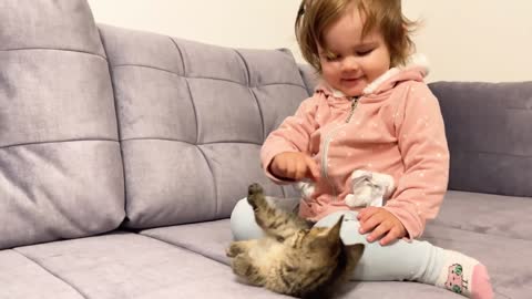 Cute baby meet new baby kitten for the first time