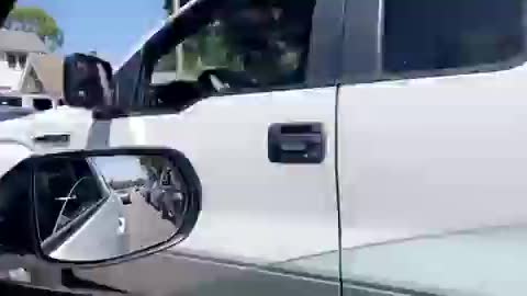 People Line up For Free Gas Give-Away at a Gas Station in Milwaukee